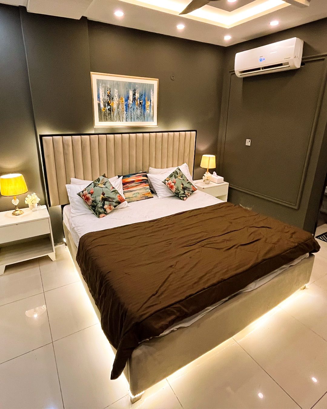 The bedroom at Eiffel View Suite, lit at night